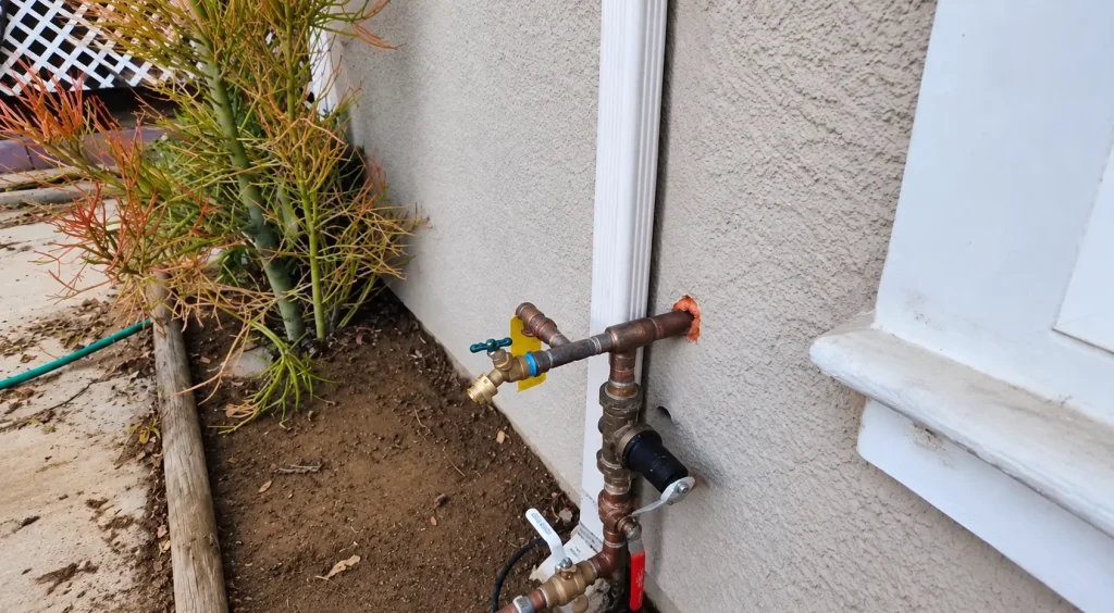 Technician checking a Perris home for a hidden water leak with an acoustic listening device